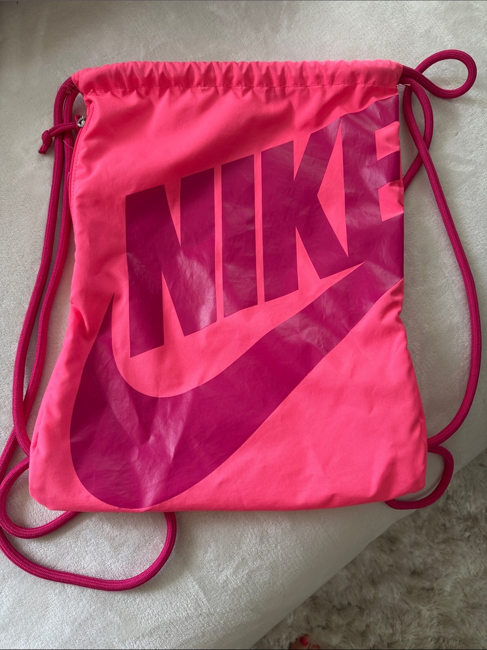 Pink on pink Nike sling bag